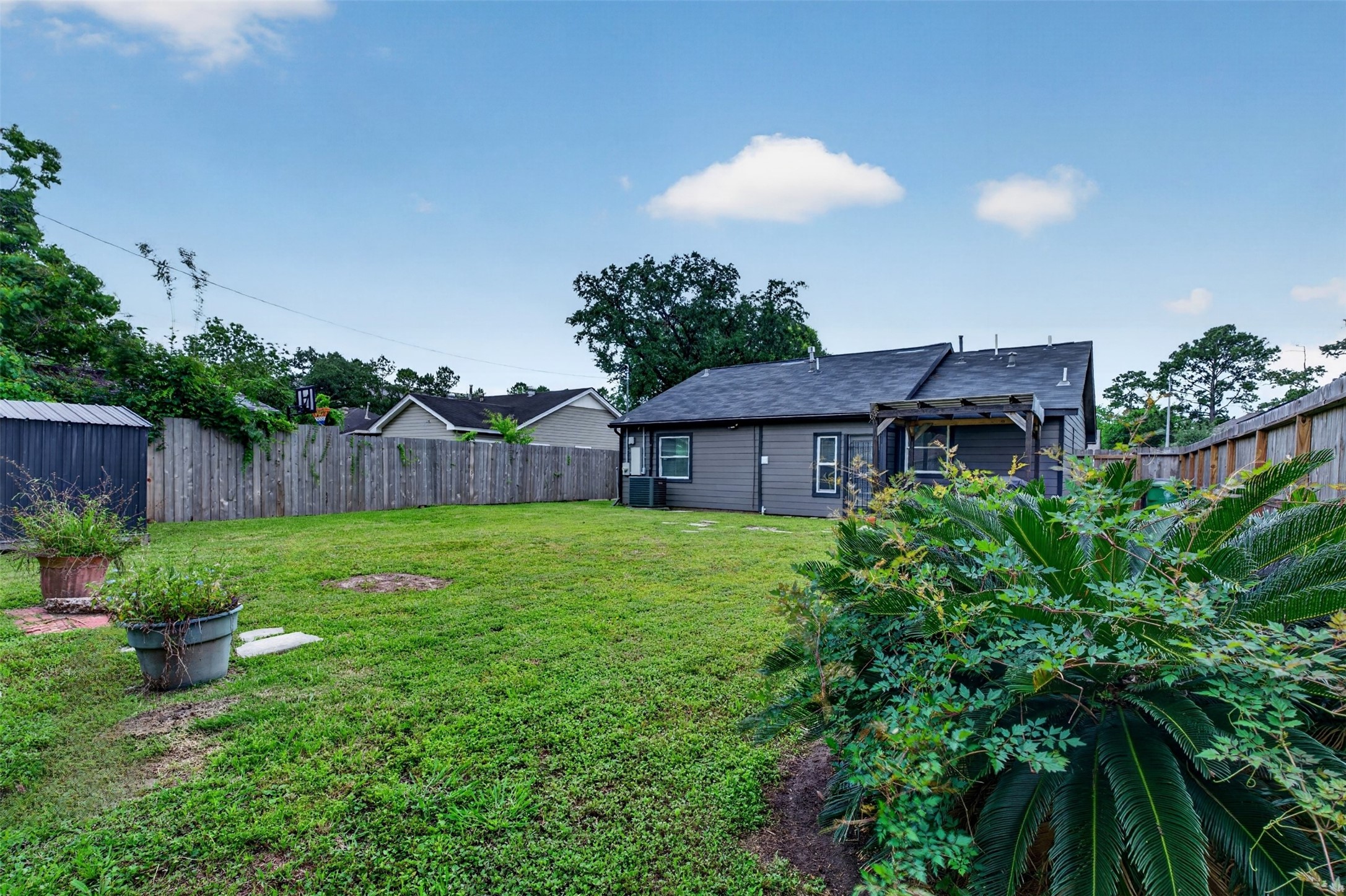 3863 Arbor Street Houston, TX 77004 - Photo 32 of 35 a view of a house with a backyard and a garden