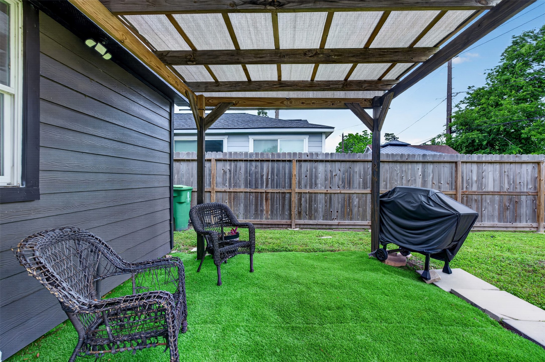 3863 Arbor Street Houston, TX 77004 - Photo 35 of 35 a view of a chair and table in backyard of the house