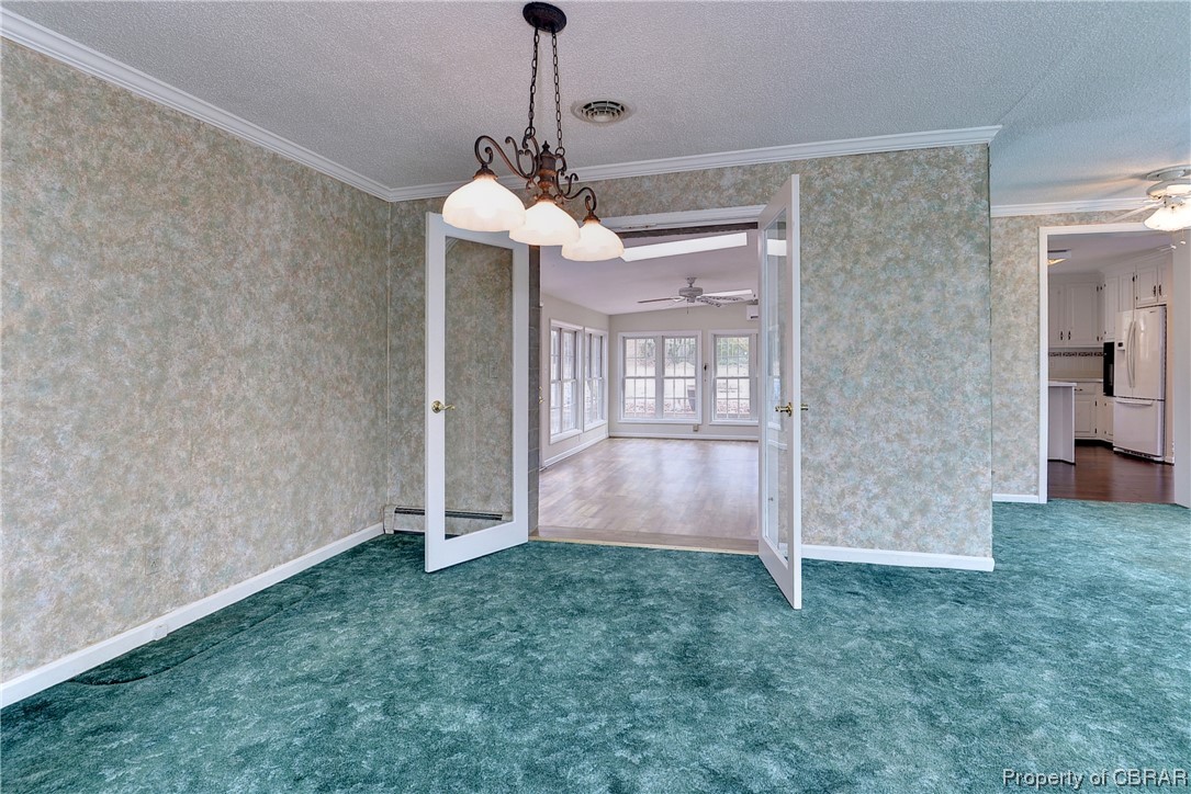 3159 Old Stage Road Toano, VA 23168 - Photo 17 of 44 French doors leading to the large sunroom
