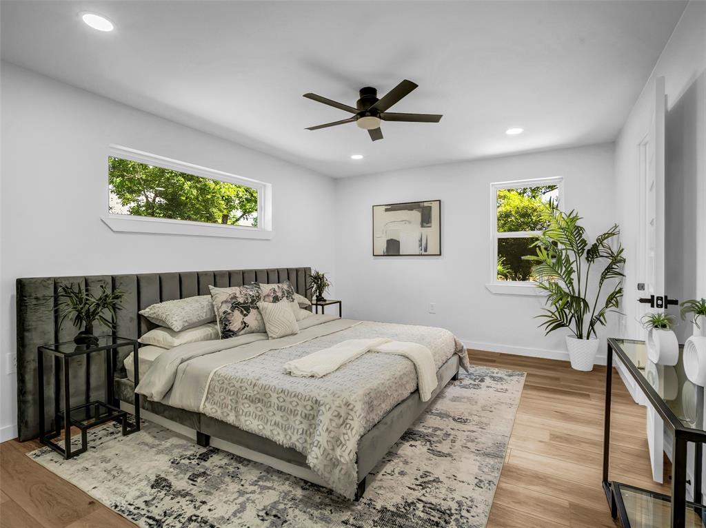 2371 Chart Drive Dallas, TX 75228 - Photo 17 of 31 a bedroom with a large bed and a potted plant