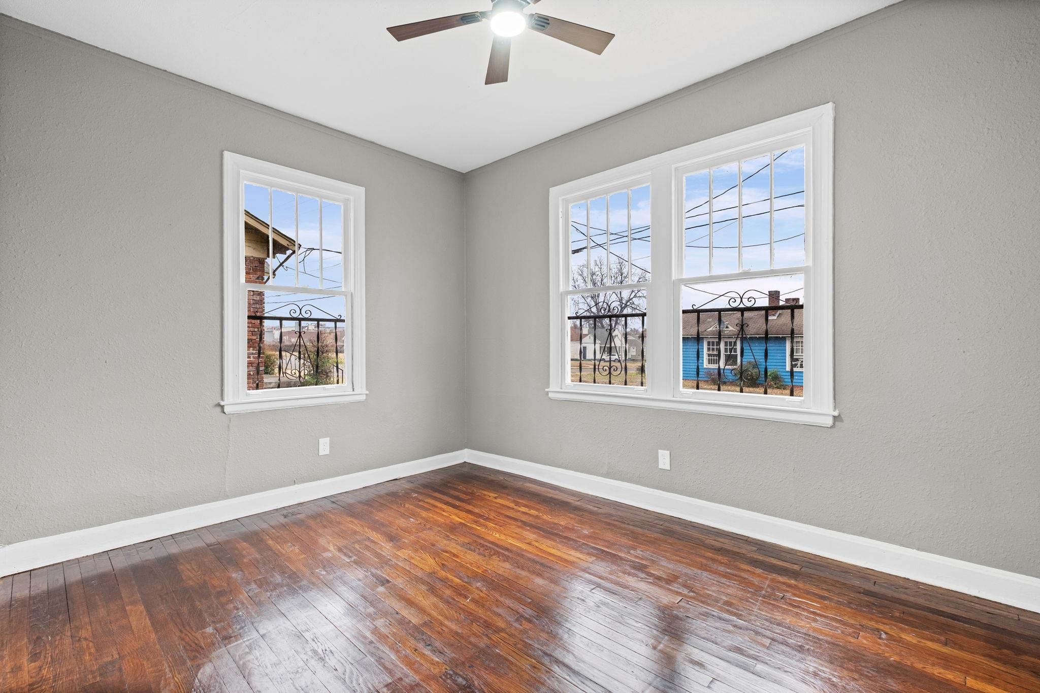 1503 Swift Street Memphis, TN 38109 - Photo 11 of 17 a view of empty room with wooden floor and fan