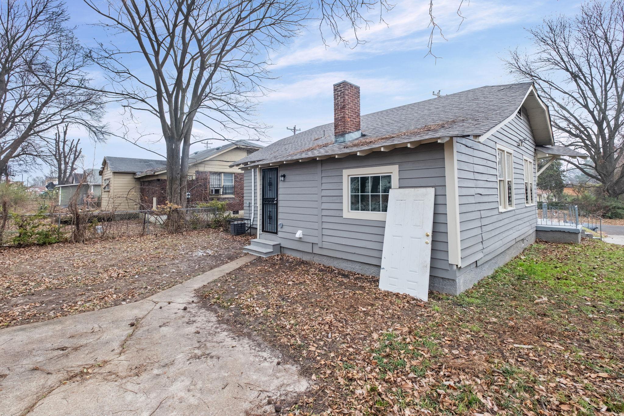 1503 Swift Street Memphis, TN 38109 - Photo 16 of 17 a front view of a house with garden