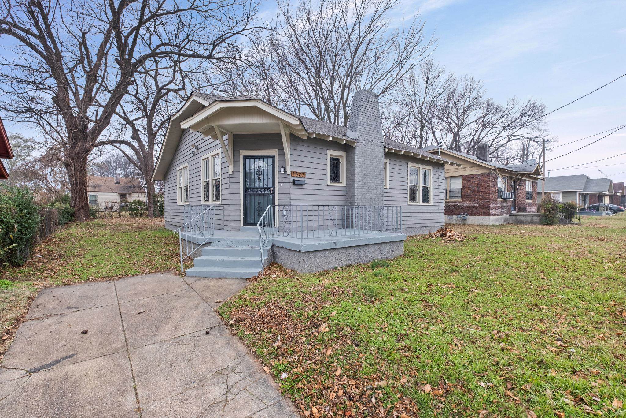 1503 Swift Street Memphis, TN 38109 - Photo 17 of 17 a front view of a house with garden