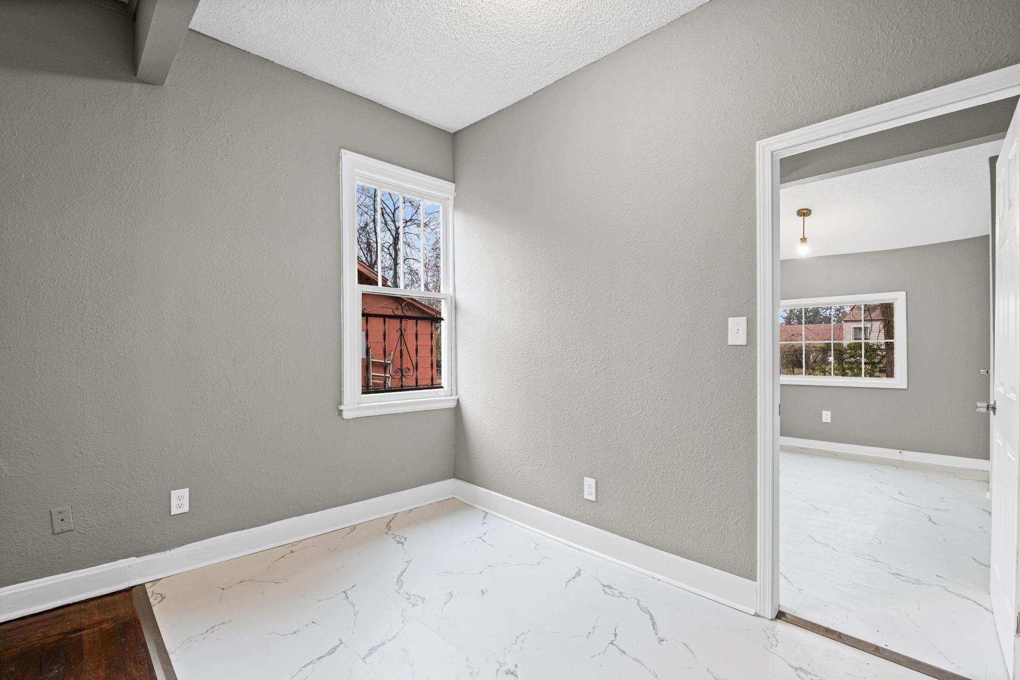 1503 Swift Street Memphis, TN 38109 - Photo 2 of 17 an empty room with windows and closet