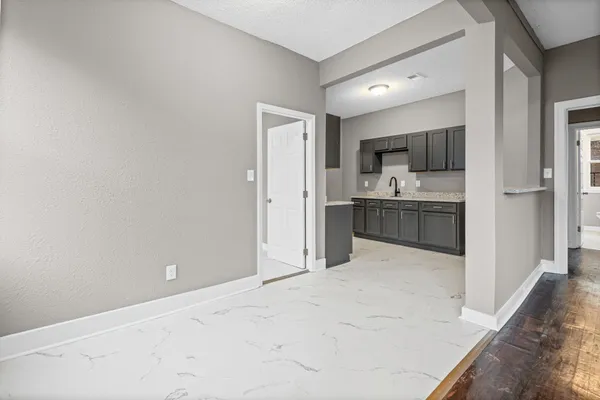 a view of kitchen and kitchen with a sink