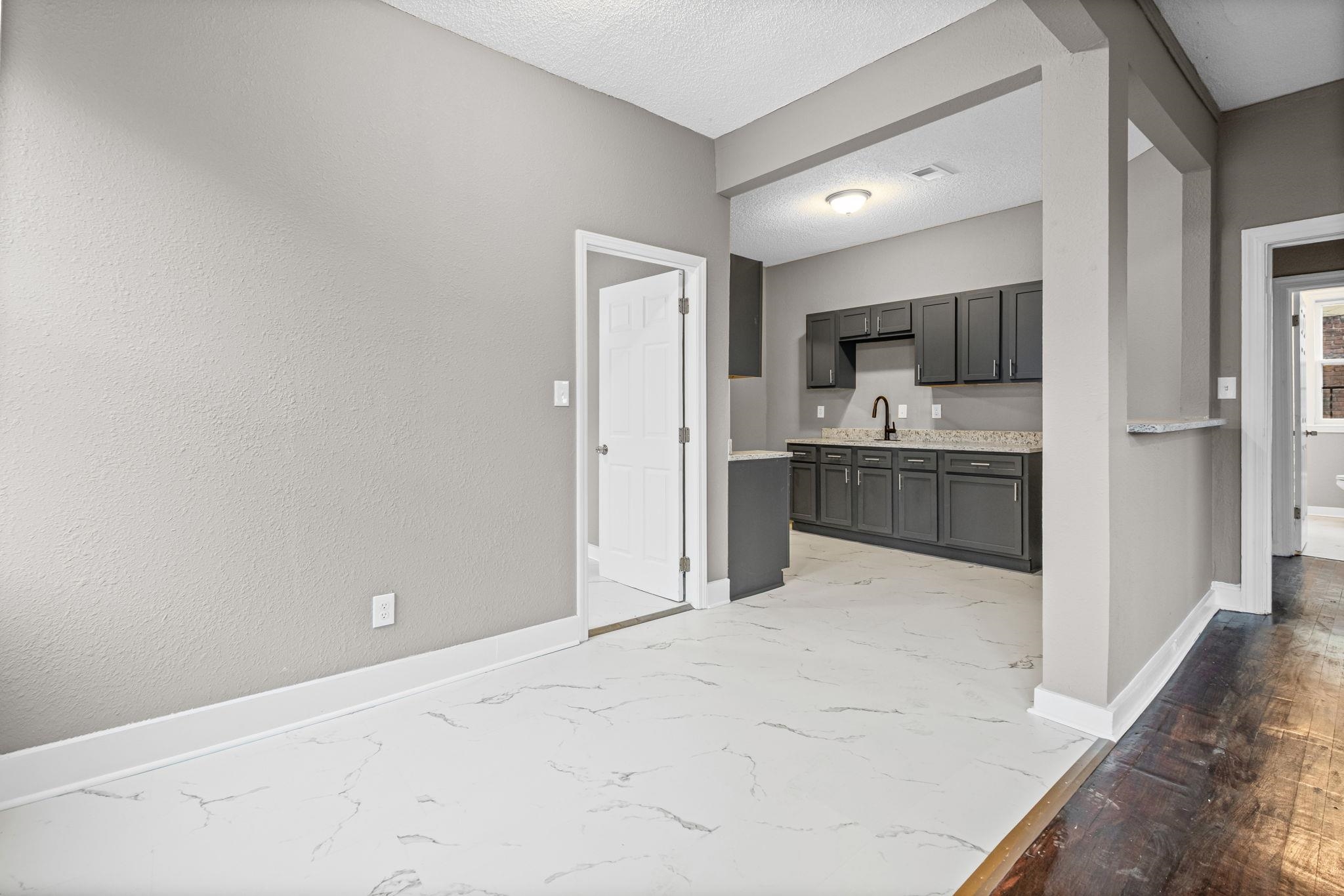 1503 Swift Street Memphis, TN 38109 - Photo 8 of 17 a view of kitchen and kitchen with a sink