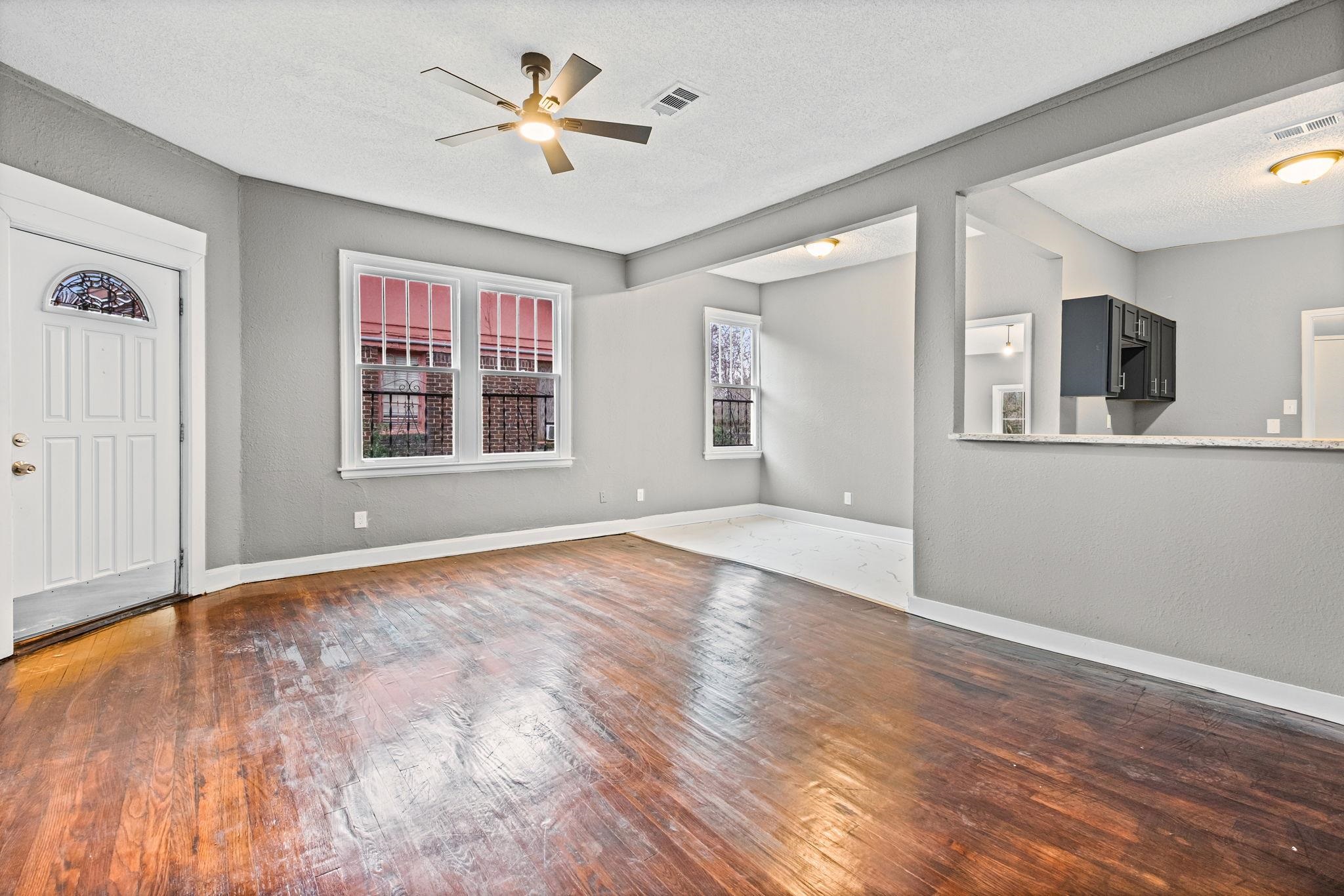1503 Swift Street Memphis, TN 38109 - Photo 10 of 17 a view of empty room with wooden floor and fan