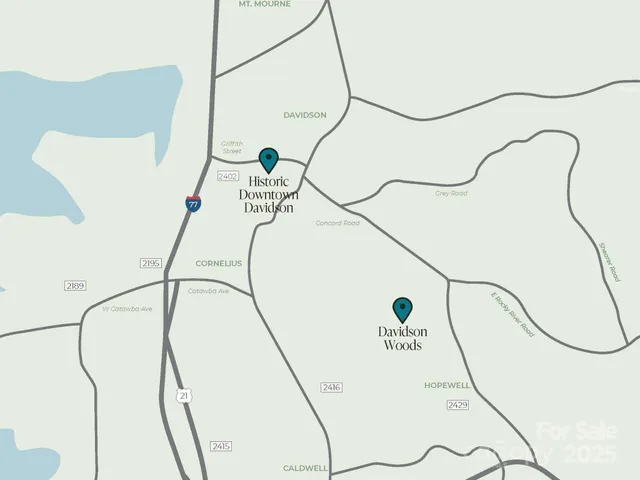 a picture of a room with a white bed and a painting on the wall