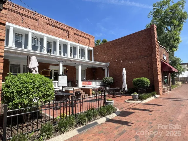 a view of a chairs and table in the patio