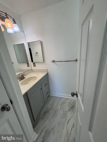 a utility room with cabinets washer and dryer