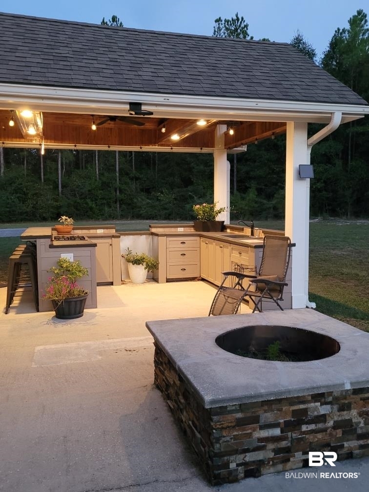 667 Lake Juniper Road Brewton, AL 36426 - Photo 6 of 20 Firepit/Outdoor Kitchen