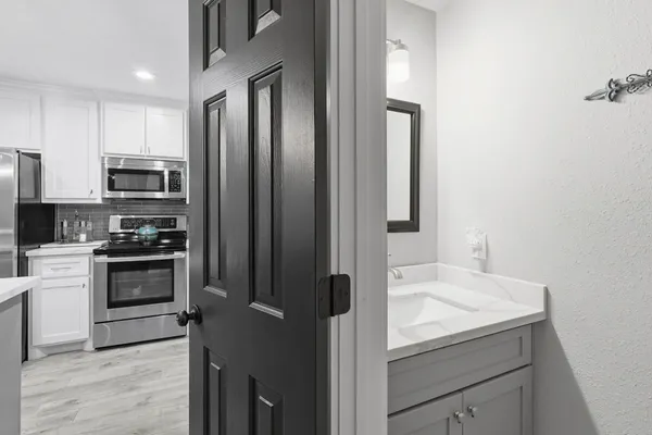 a white bath tub sitting next to a shower