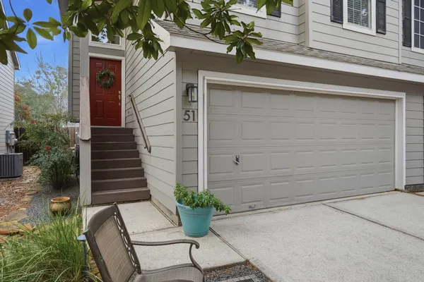 a potted plant sitting in front of a house