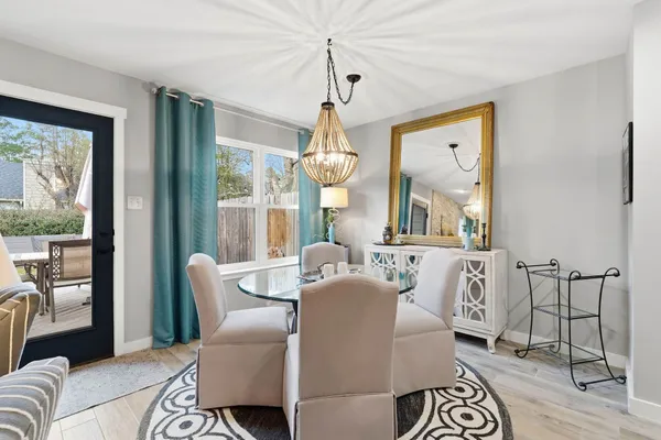 a view of a dining room with furniture window and outside view