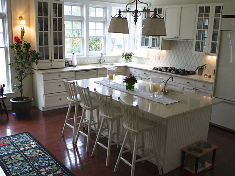 56 Riverside Lane Riverside, CT 06878 - Photo 3 of 11 a kitchen with a sink and cabinets