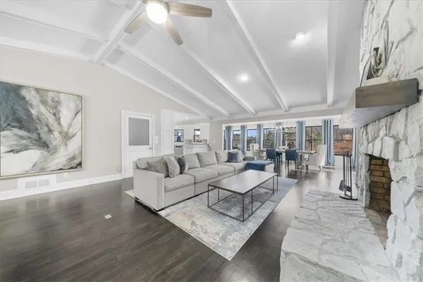 a view of a dining room with furniture wooden floor and chandelier