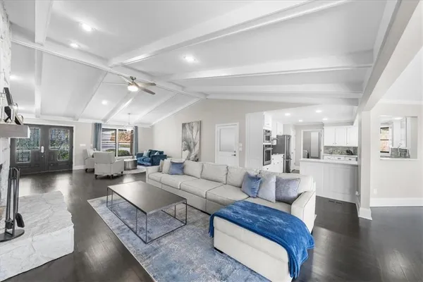 a view of a dining room with furniture wooden floor and chandelier