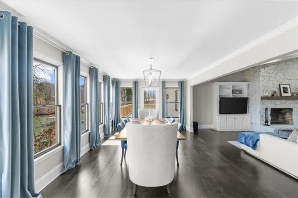 a kitchen with stainless steel appliances white cabinets and a refrigerator