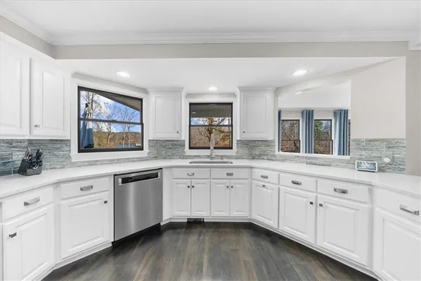 a spacious bathroom with a double vanity sink mirror and shower