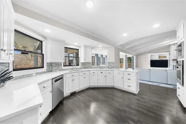 a bathroom with a sink vanity granite and a mirror