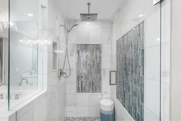 a view of empty room with wooden floor and window