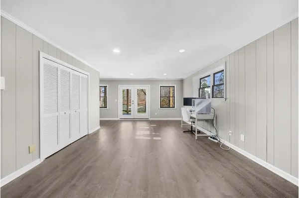 an aerial view of a house with swimming pool patio and lake view