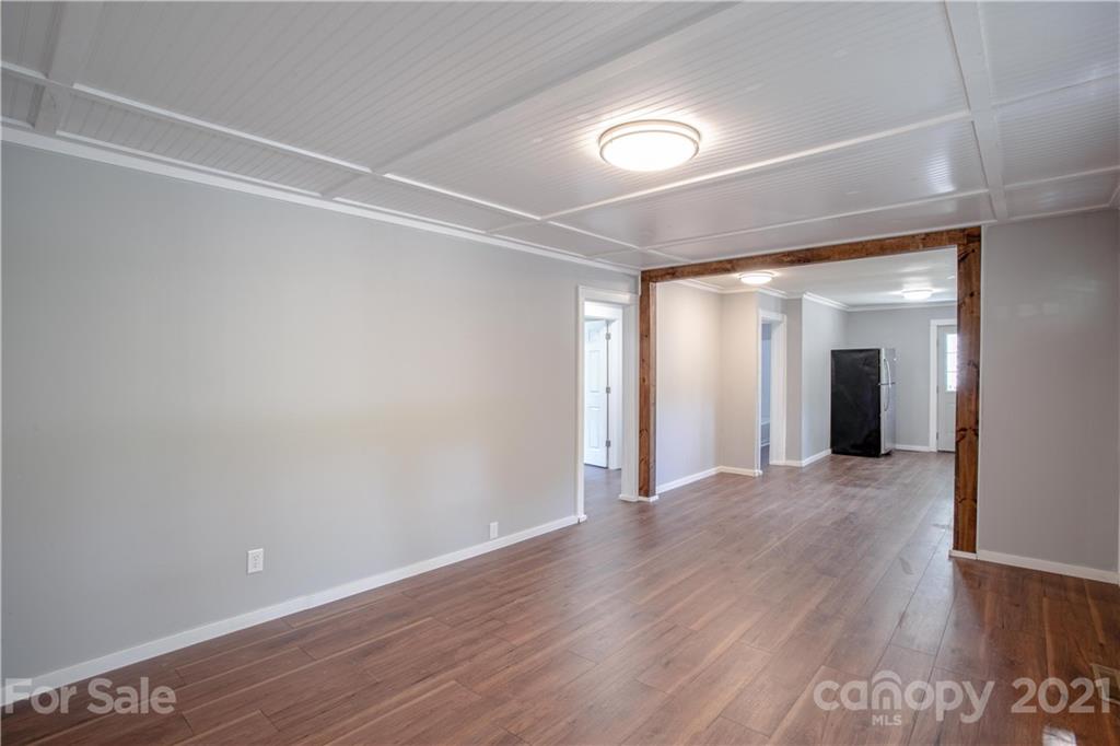 124 Harris Street Rutherfordton, NC 28139 - Photo 8 of 33 a view of wooden floor and windows in a room