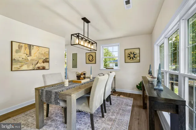 a view of a dining room with furniture window and outside view