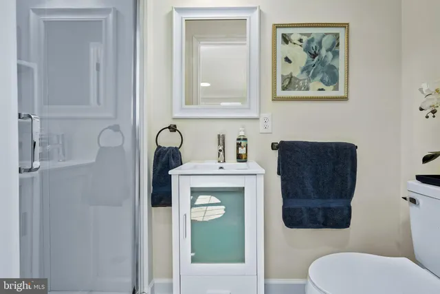 a bathroom with a toilet and a sink