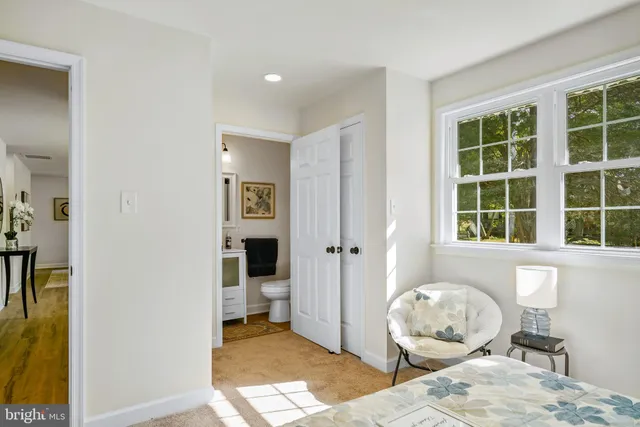 a living room with furniture and windows