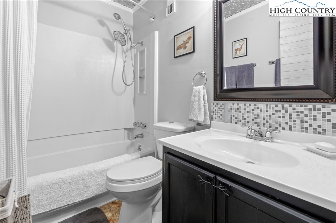 301 Pinnacle Inn Road, Unit 3219 Beech Mountain, NC 28604 - Photo 15 of 30 a bathroom with a sink a toilet and shower