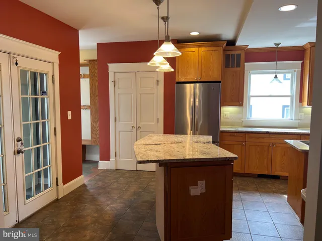 a view of an empty room and wooden floor