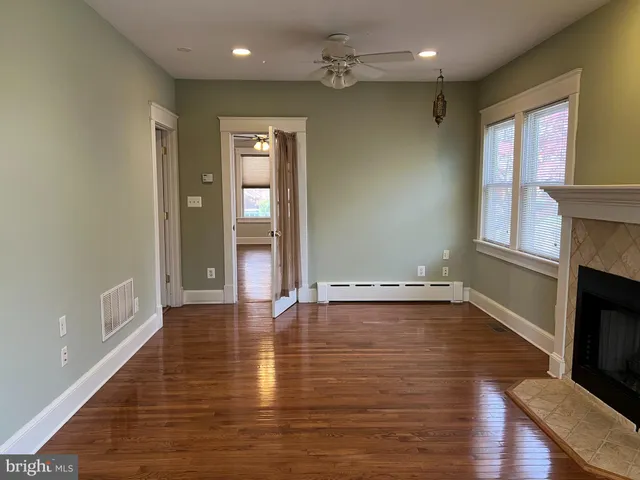 a view of gallery with wooden floor