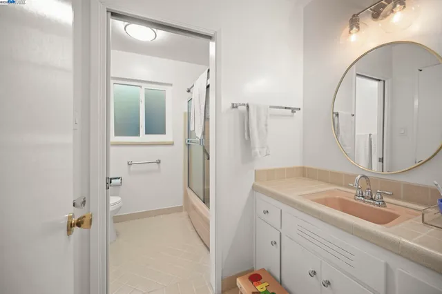 a view of a kitchen from a hallway