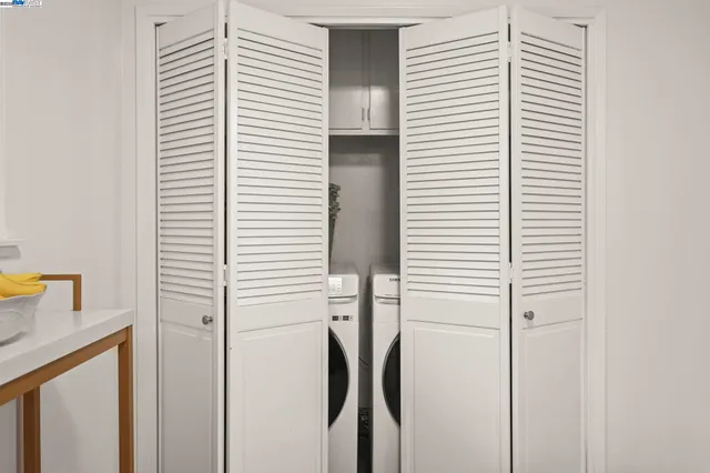 a view of a table and chairs in backyard of the house
