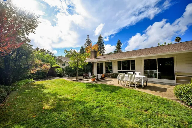a bedroom with a bed and a desk