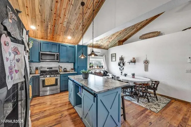 a large bathroom with a granite countertop double vanity sink a mirror and a bathtub