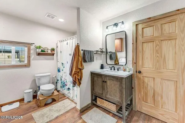 a kitchen with sink cabinets and stove top oven