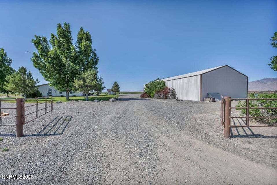 2505 Baines Road Winnemucca, NV 89445 - Photo 43 of 45 a backyard of a house with lots of green space