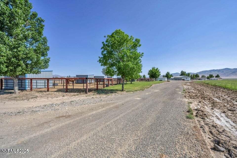 2505 Baines Road Winnemucca, NV 89445 - Photo 9 of 45 a front view of a house with a yard and garage