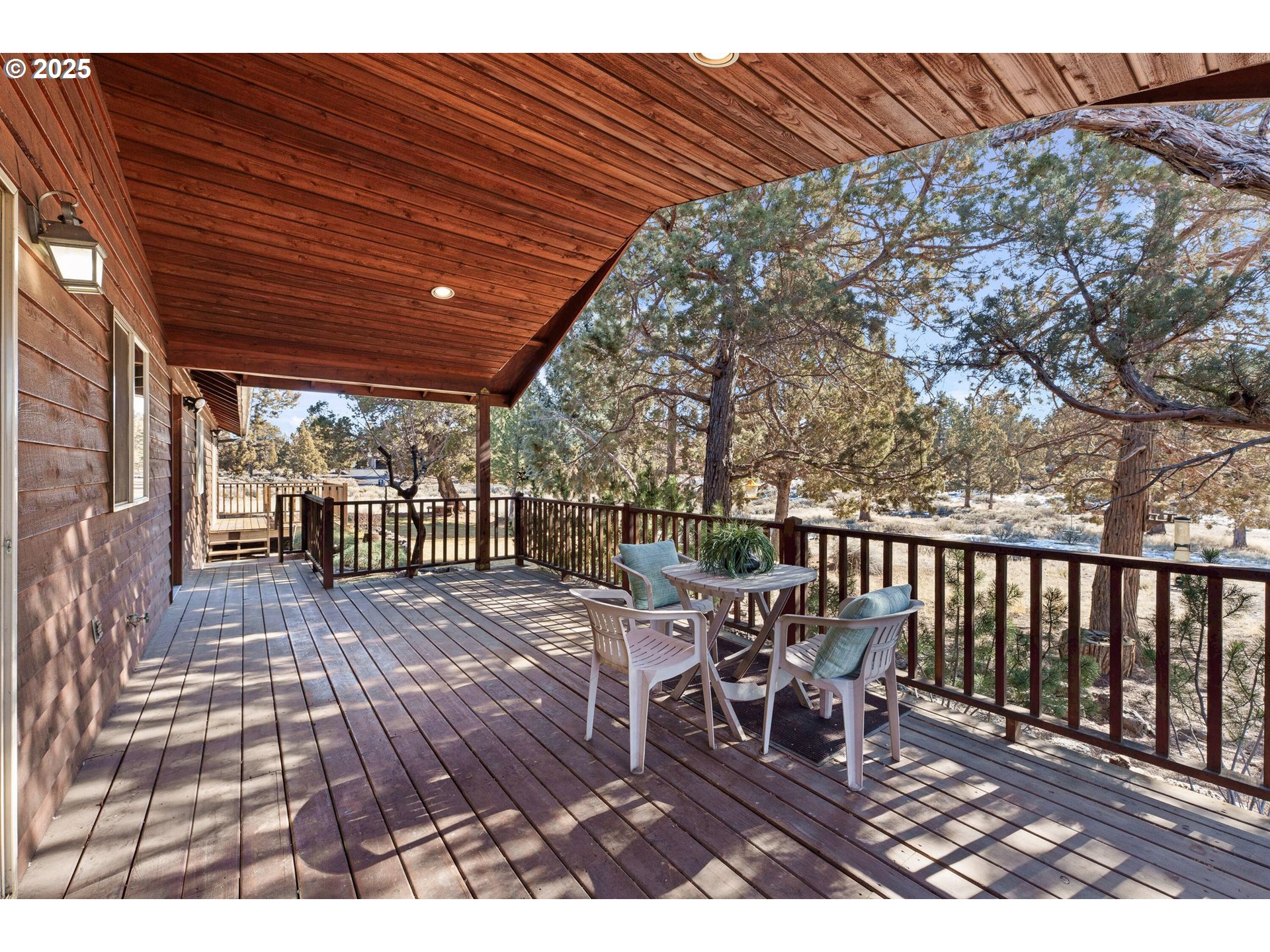 64520 Joe Neil Road Bend, OR 97701 - Photo 11 of 40 a view of a chairs and table on the wooden floor