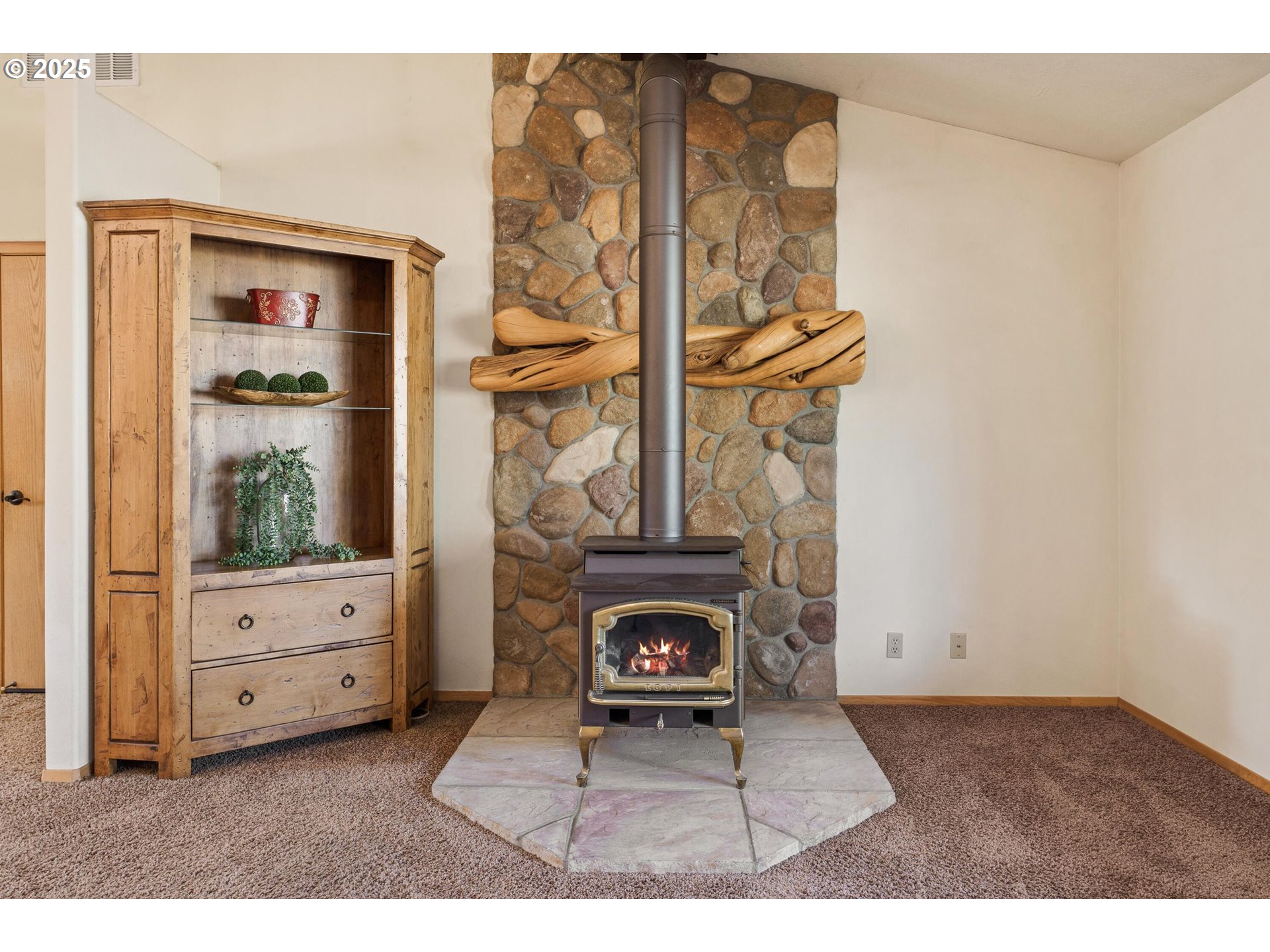 64520 Joe Neil Road Bend, OR 97701 - Photo 15 of 40 a living room with furniture and a fireplace