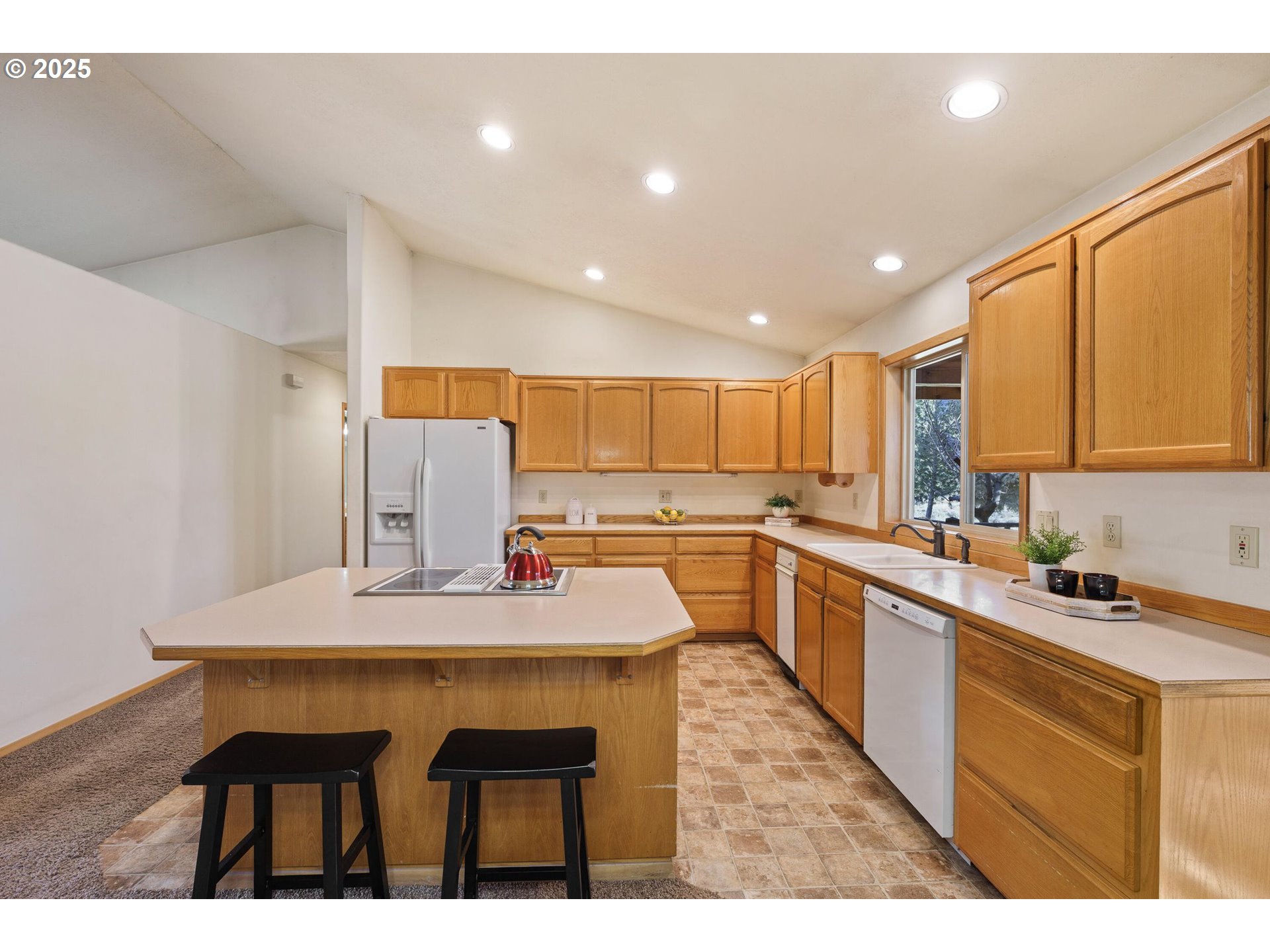 64520 Joe Neil Road Bend, OR 97701 - Photo 19 of 40 a kitchen with a sink cabinets and counter space