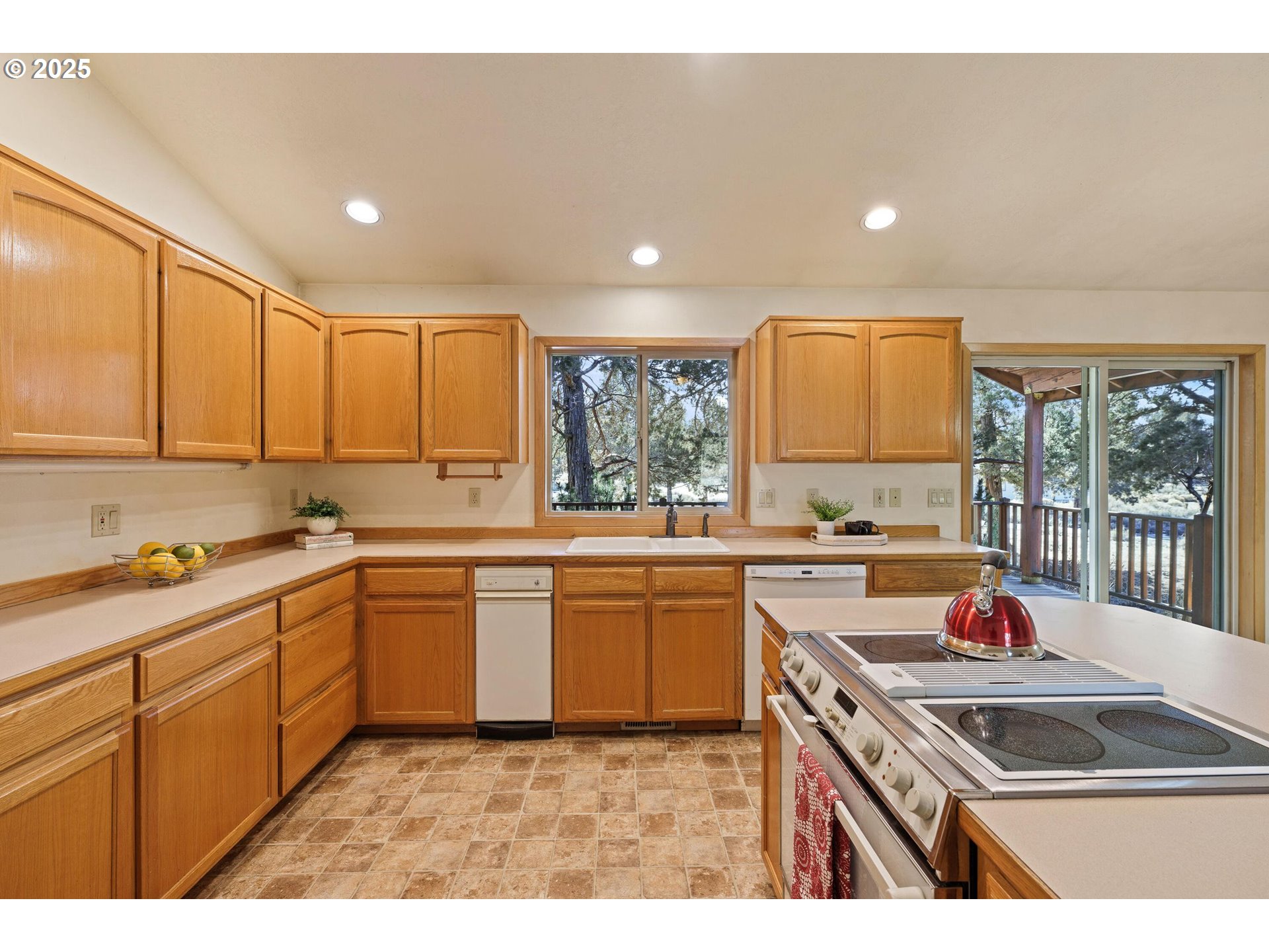 64520 Joe Neil Road Bend, OR 97701 - Photo 20 of 40 a kitchen that has a sink and a stove in it