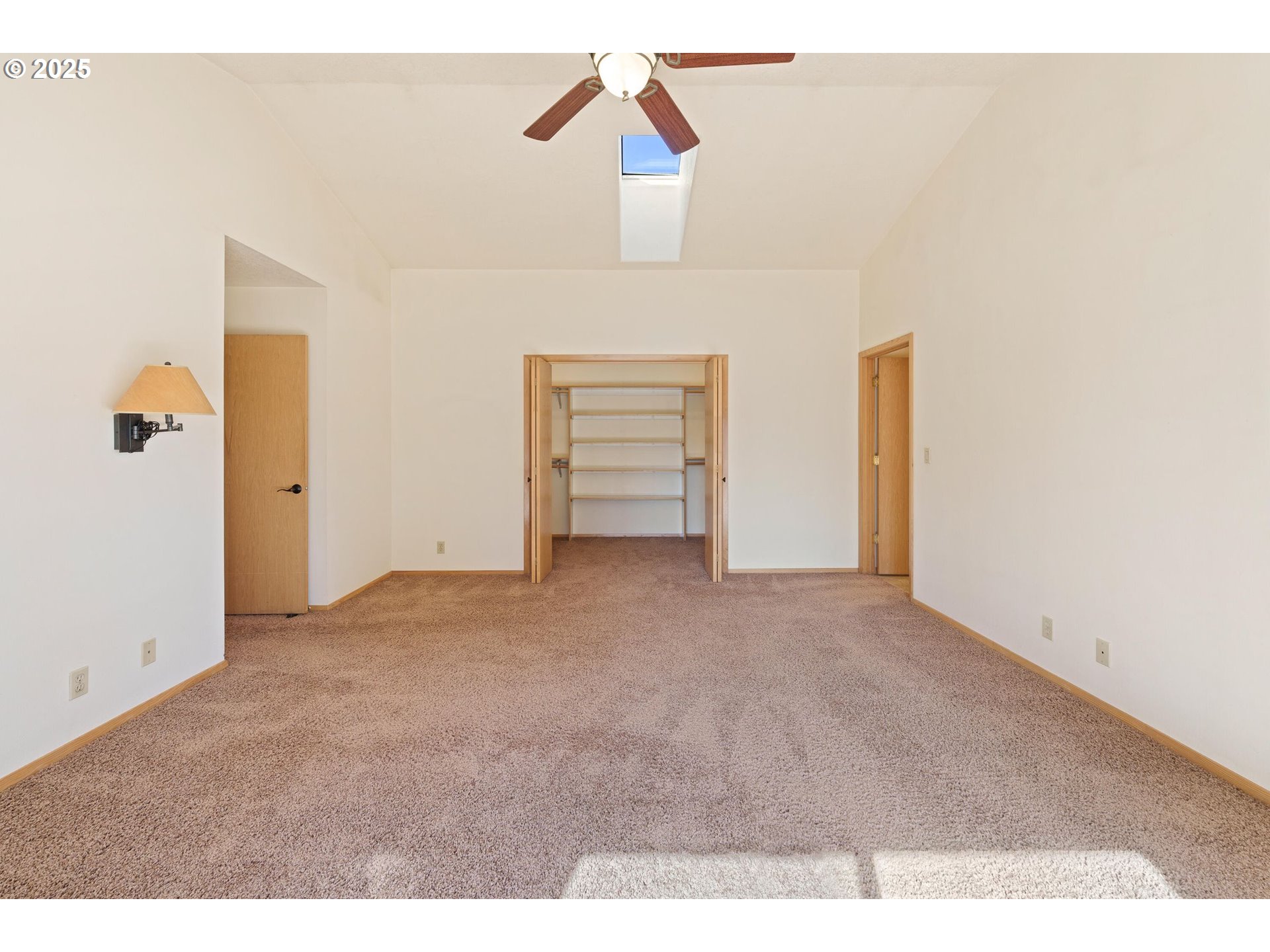 64520 Joe Neil Road Bend, OR 97701 - Photo 24 of 40 a view of an empty room with a ceiling fan