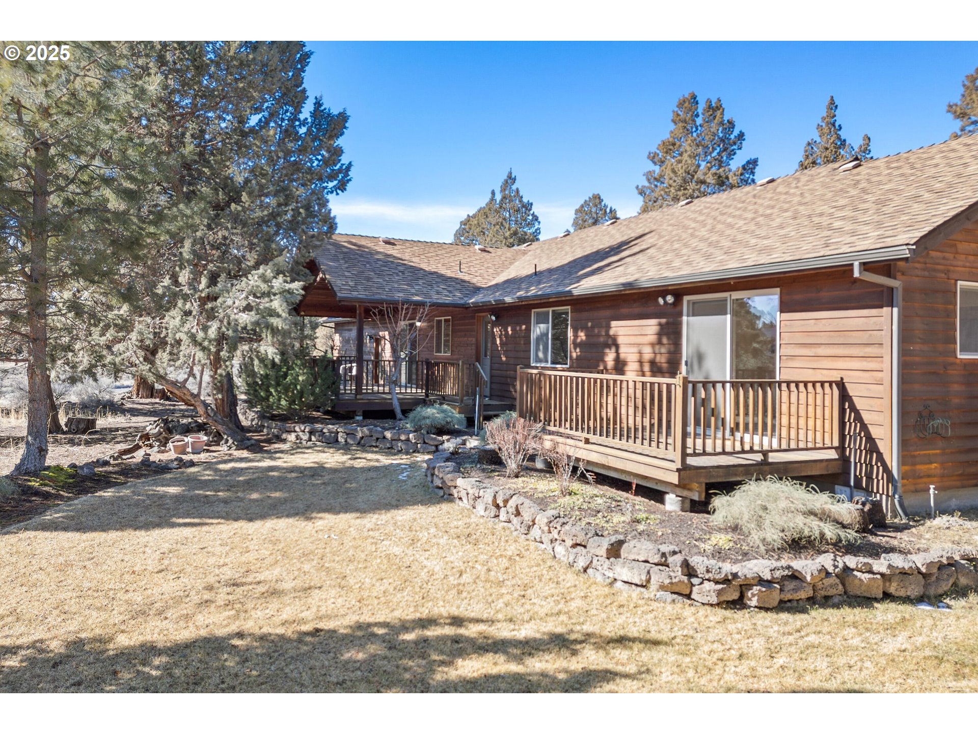 64520 Joe Neil Road Bend, OR 97701 - Photo 7 of 40 a view of a house with a wooden deck