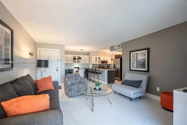 a living room with furniture and a table