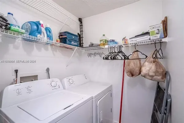 a utility room with dryer and washer