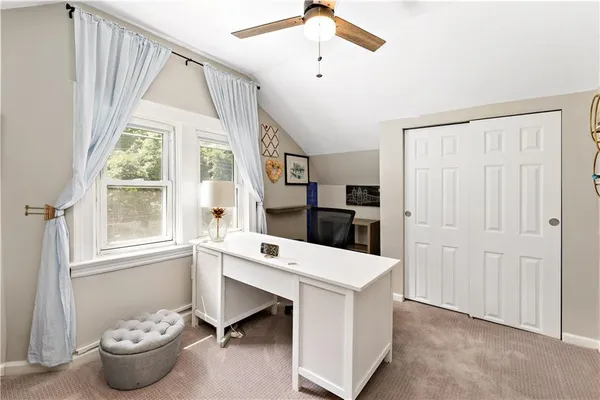 a living room with a window and a table