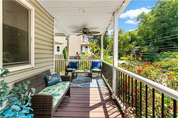 a view of a balcony with chairs